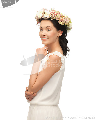 Image of woman wearing wreath of flowers