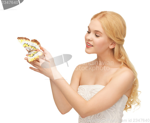 Image of woman with butterfly in hand