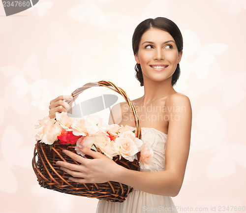 Image of woman with basket full of flowers