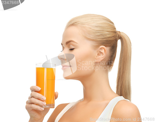 Image of young woman drinking orange juice