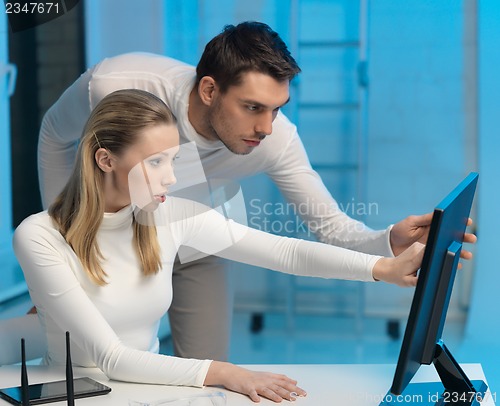 Image of man and woman in laboratory
