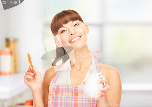 Image of housewife with milk and cookies