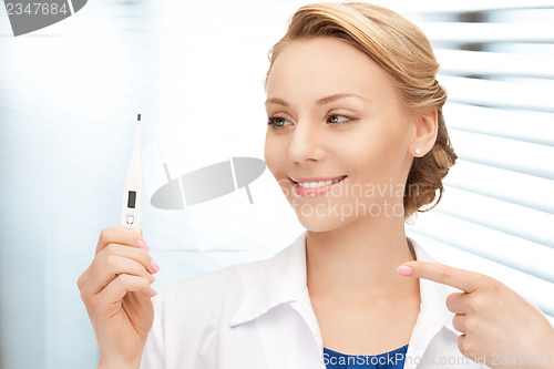 Image of attractive female doctor with thermometer