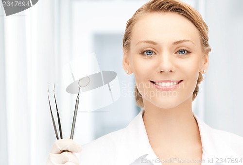 Image of dentist with tools