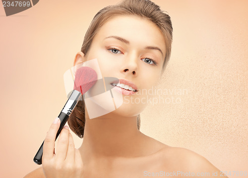 Image of beautiful woman with brush