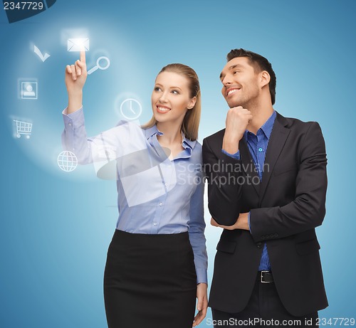 Image of man and woman working with virtual screen