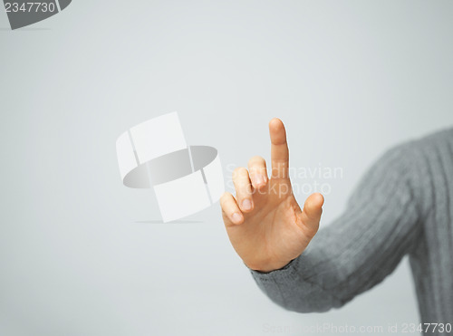 Image of man pressing imaginary button