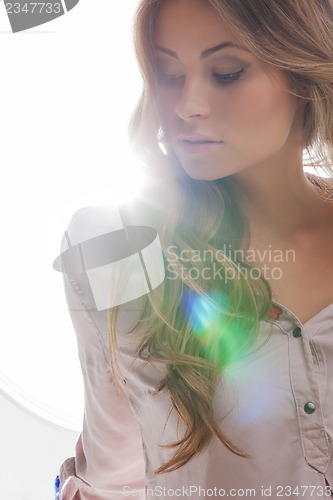 Image of beautiful woman in casual clothes