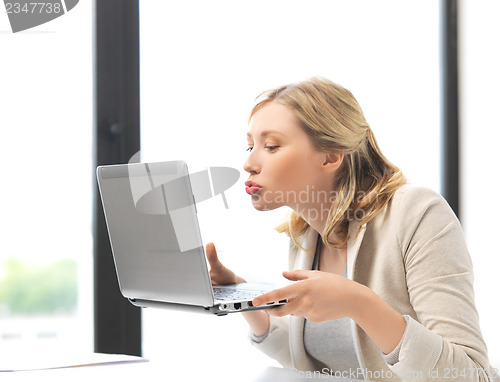 Image of happy woman with laptop computer