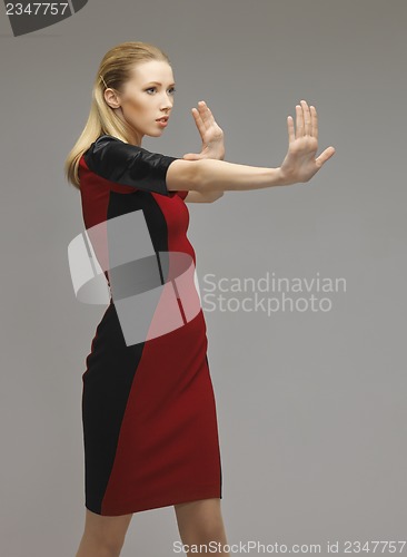 Image of woman working with something imaginary