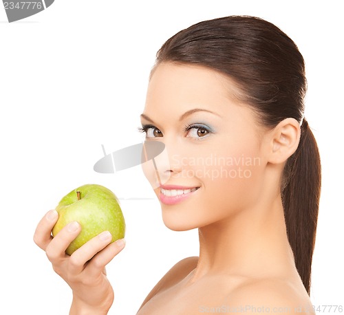 Image of smiling woman in with an apple
