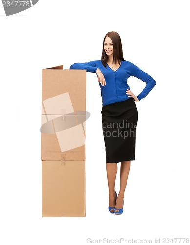 Image of businesswoman with big carton boxes