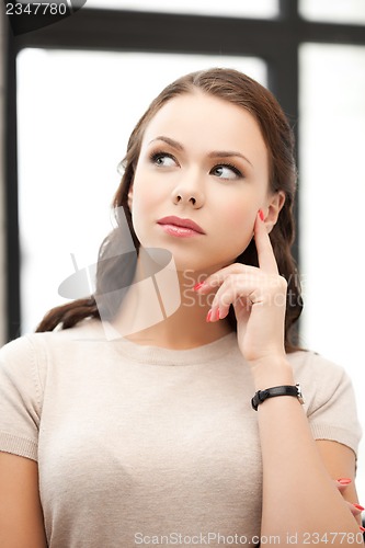 Image of calm and serious thinking woman