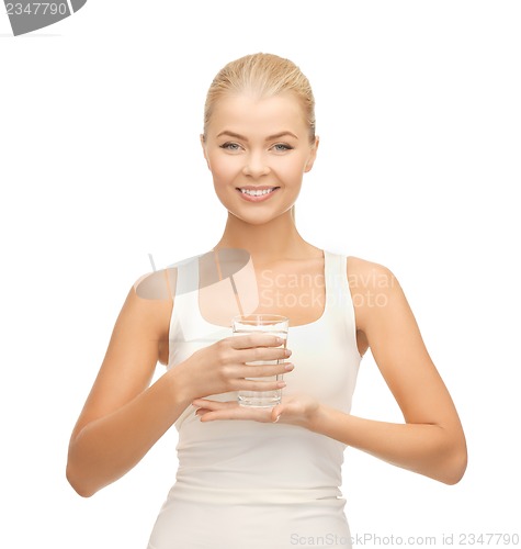 Image of young smiling woman with glass of water