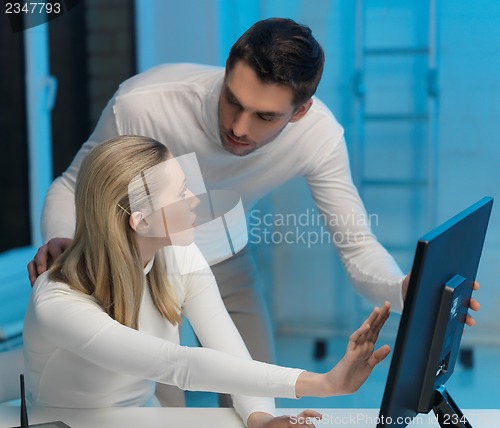 Image of man and woman in laboratory