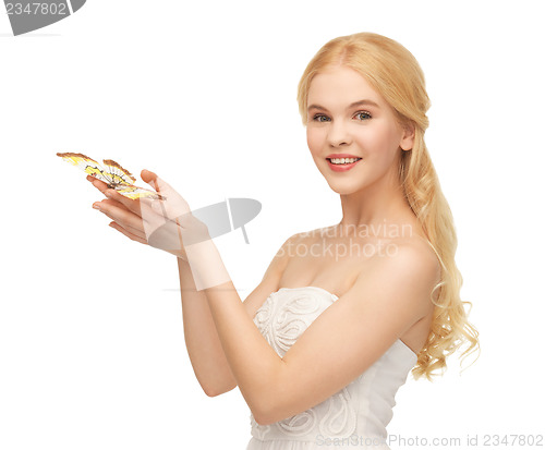 Image of woman with butterfly in hand