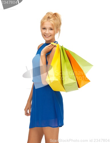 Image of happy teenage girl with shopping bags