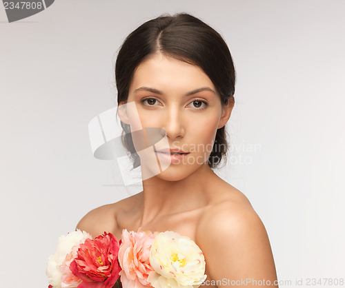 Image of relaxed woman with flowers