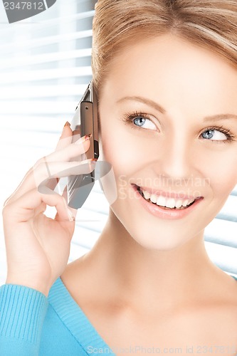 Image of businesswoman with cell phone calling