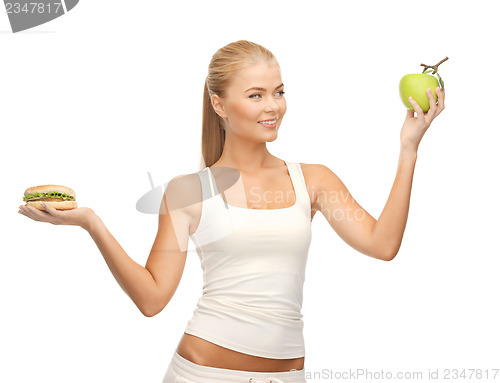 Image of woman with apple and hamburger