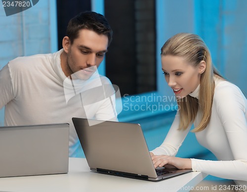 Image of man and woman in laboratory