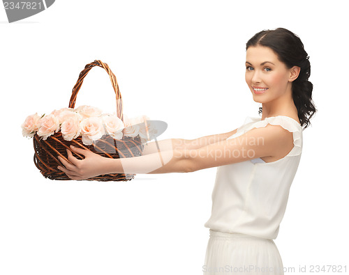 Image of woman with basket full of flowers