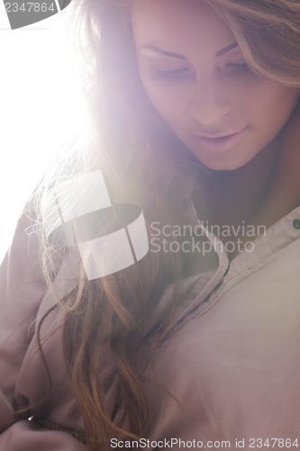 Image of beautiful woman in casual clothes