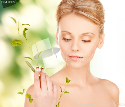 Image of woman with green sprout