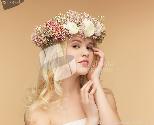 Image of woman wearing wreath of flowers