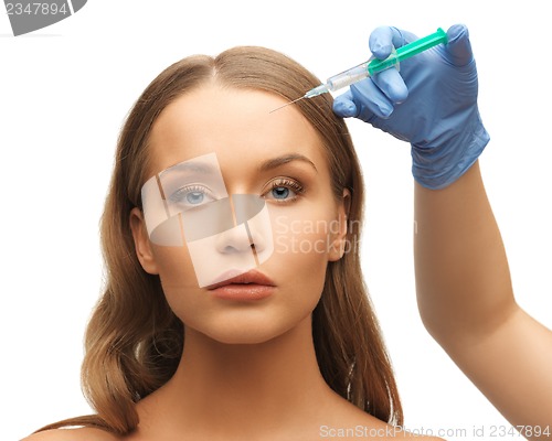 Image of woman face and beautician hands