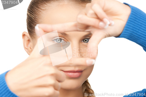 Image of woman creating a frame with fingers