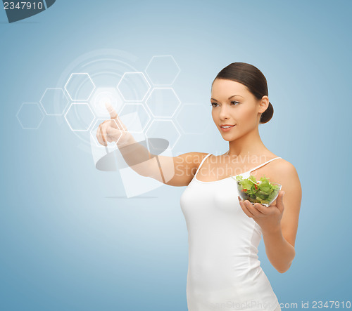 Image of woman with salad and virtual screen