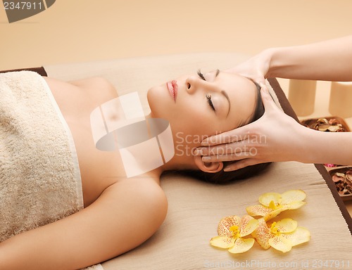 Image of beautiful woman in massage salon