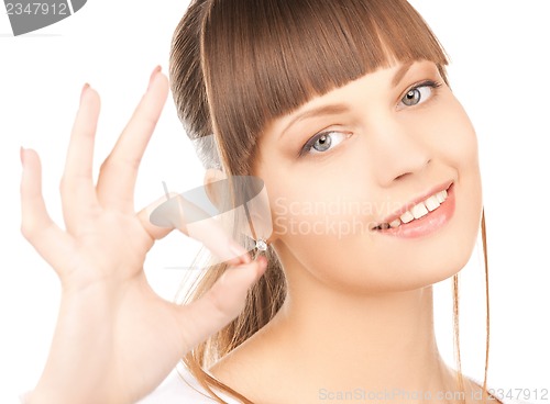 Image of young woman showing ok sign
