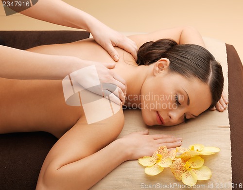 Image of beautiful woman in massage salon