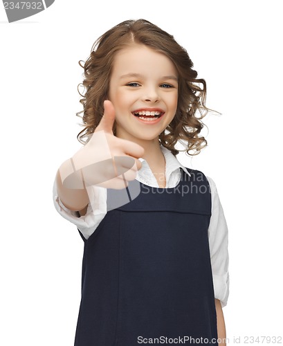 Image of pre-teen girl showing thumbs up