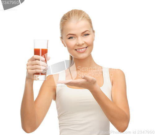 Image of woman holding glass of tomato juice