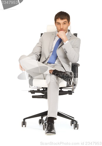 Image of man sitting in chair