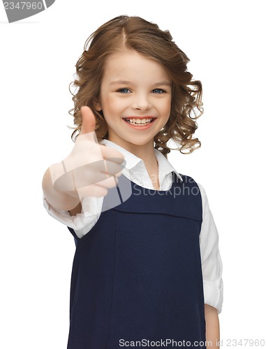 Image of pre-teen girl showing thumbs up