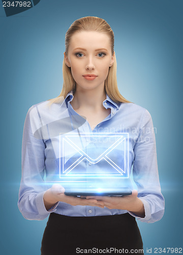 Image of woman with tablet pc sending e-mail