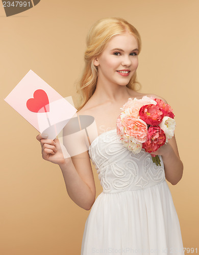 Image of young woman holding flower and postcard