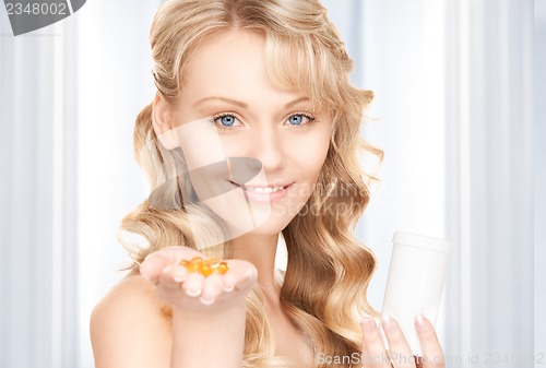 Image of young woman with pills