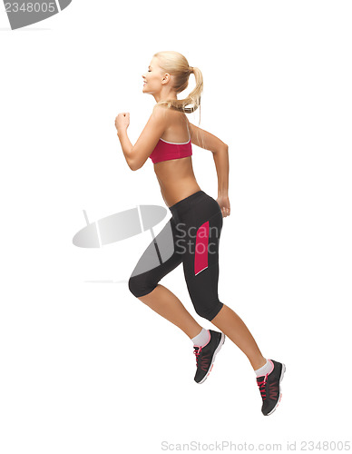 Image of sporty woman running or jumping