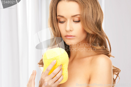 Image of beautiful woman with sponge