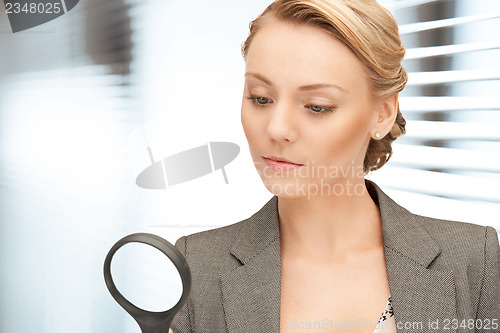 Image of woman with magnifying glass