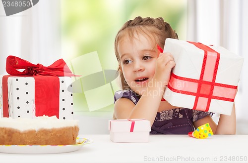 Image of litle girl with birthday cake