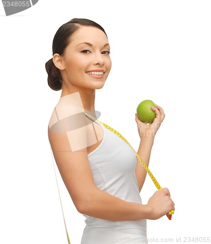 Image of woman with measuring tape and apple