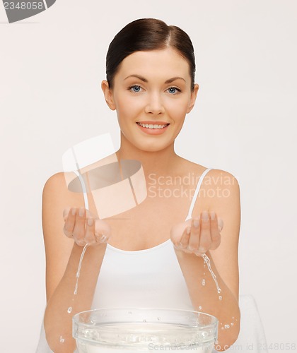 Image of woman washing her face