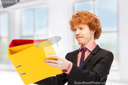 Image of man with folders