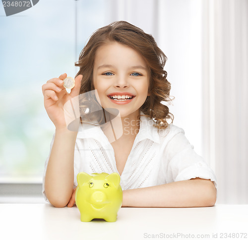 Image of girl with piggy bank